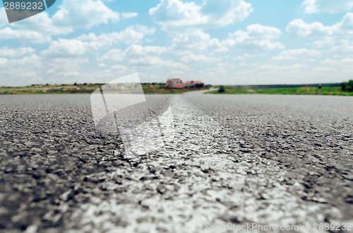 Image of white line on asphalt road close up