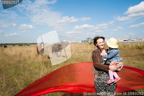 Image of Happy mother with little daughter
