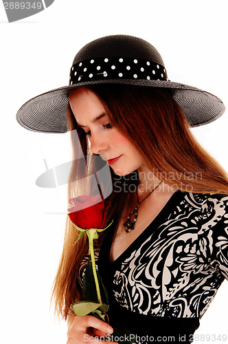 Image of Woman with hat and rose.