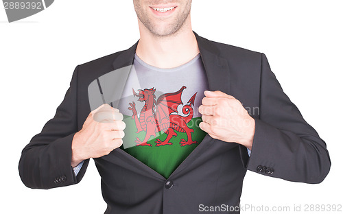 Image of Businessman opening suit to reveal shirt with flag