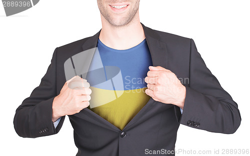 Image of Businessman opening suit to reveal shirt with flag