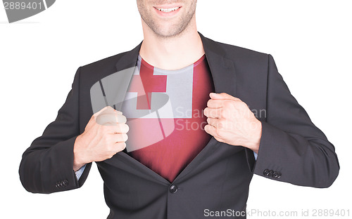 Image of Businessman opening suit to reveal shirt with flag