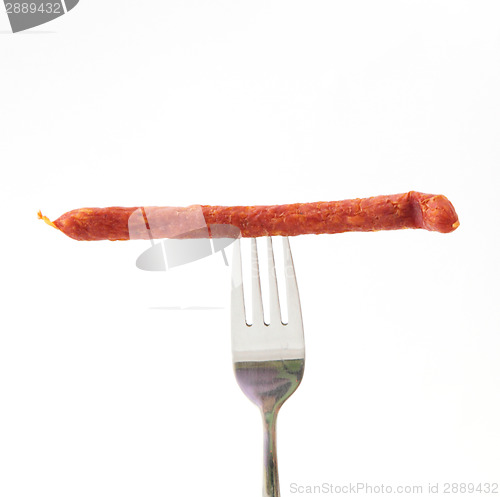 Image of sausage on a fork