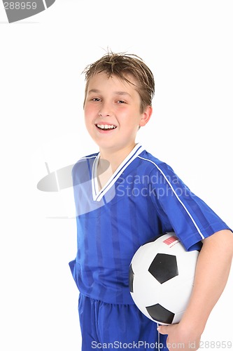 Image of Happy boy holding soccer ball