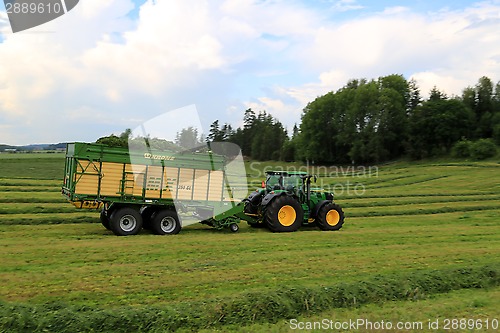 Image of John Deere 6210R Tractor and Full Krone MX 350 GL Forage Wagon