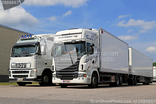 Image of White Scania R560 and Volvo FH Full Trailer Trucks