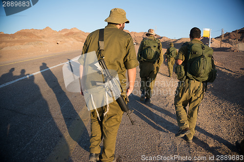 Image of Soldiers patrol in desert