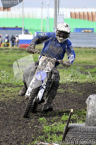 Image of Motorcyclists on motorcycles participate in cross-country race.