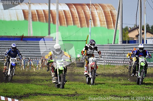 Image of Cross-country race. Motorcyclists on start.