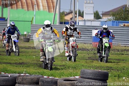 Image of Cross-country race. Motorcyclists on start.