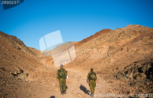 Image of Soldiers patrol in desert