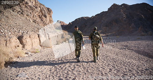 Image of Soldiers patrol in desert