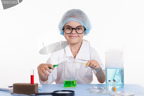 Image of Girl mixes the liquid