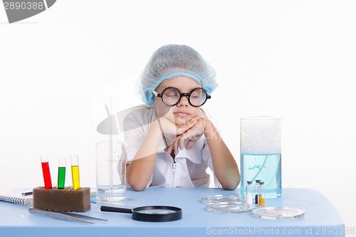 Image of Chemist girl fell asleep during the lesson