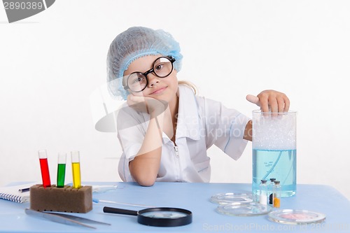 Image of Girl chemist bored in the classroom