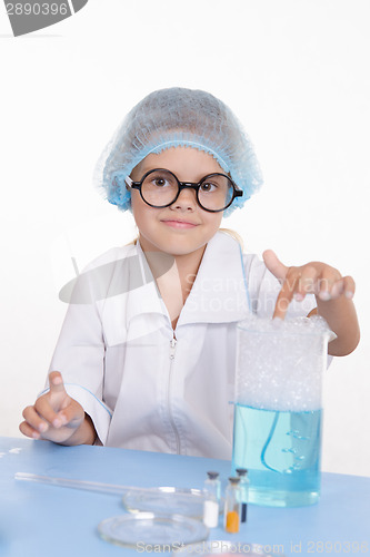 Image of Girl chemist flask with foam