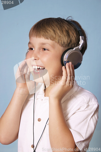 Image of Boy listening music