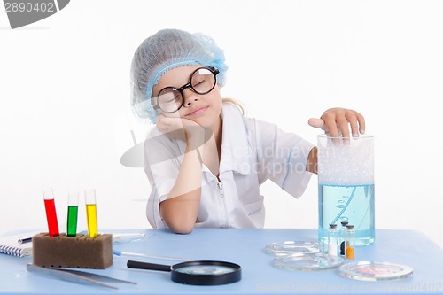 Image of Girl chemist asleep at the table