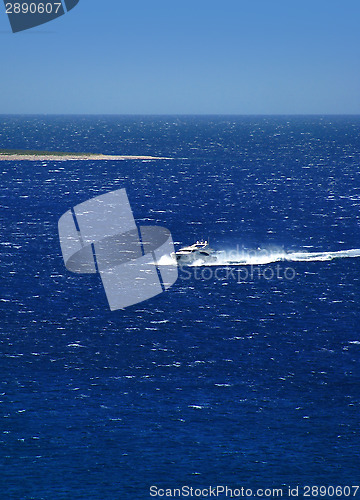 Image of Luxury yacht cruising at high speed