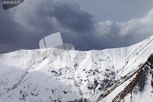 Image of Snowy mountains and overcast sky