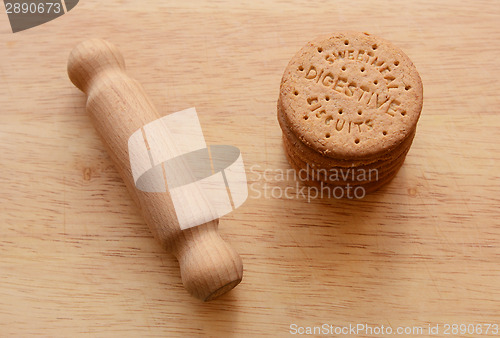 Image of Rolling pin ready to crush biscuits