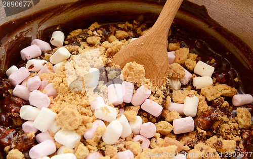 Image of Melted chocolate, marshmallows and crushed biscuits