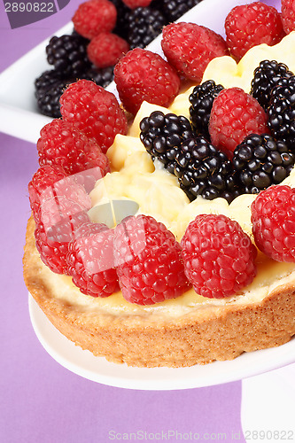 Image of Custard tart with raspberries and blackberries