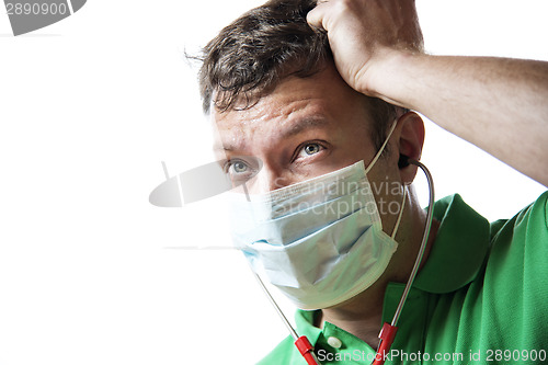 Image of Helpless, anxious and perspiring doctor