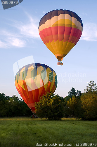 Image of Two hot-air balloons taking off or landing