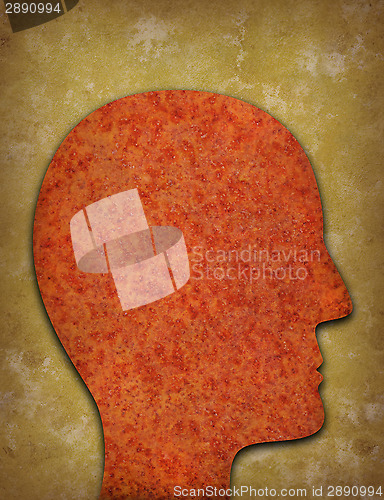 Image of Rusty head silhouette against yellowed background