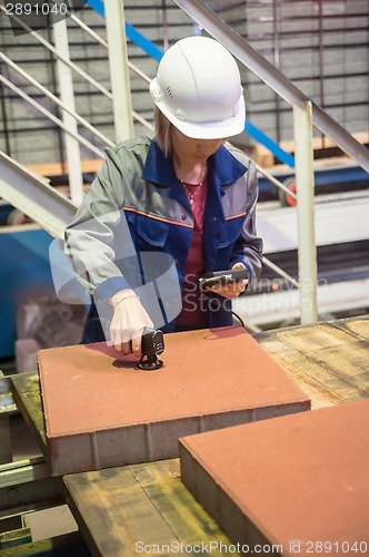 Image of Woman engineer with measuring devices