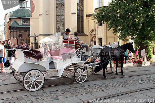 Image of promenade coach with two harnessed horses in Lvov