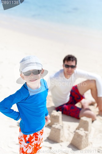 Image of family building sand castle