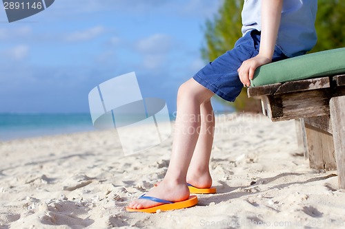 Image of boy's feet at the beach