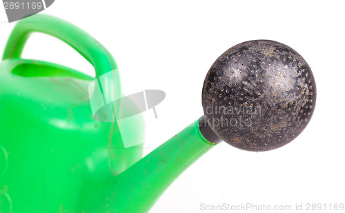 Image of Green old plastic watering can