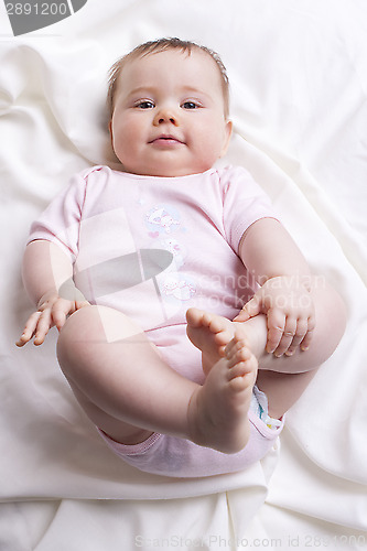 Image of Baby girl looks into the camera