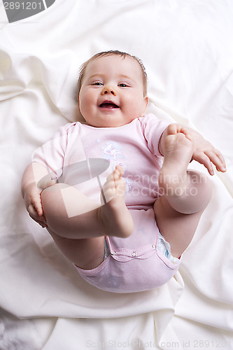 Image of Baby girl looks into the camera