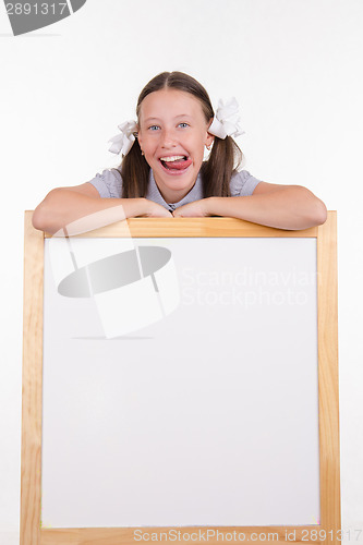 Image of Girl shows tongue advertising stand