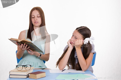 Image of Trainee teacher listens thoughtfully