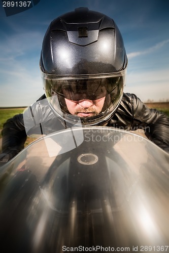 Image of Biker racing on the road