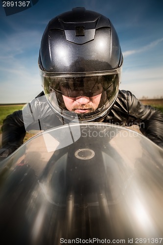 Image of Biker racing on the road