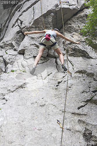 Image of Woman climbing