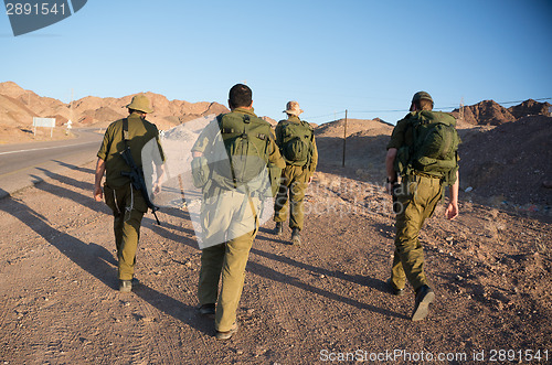 Image of Soldiers patrol in desert