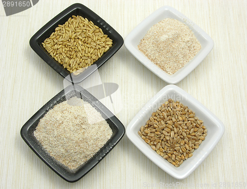 Image of Bowls of chinaware with oat, porridge and meal 