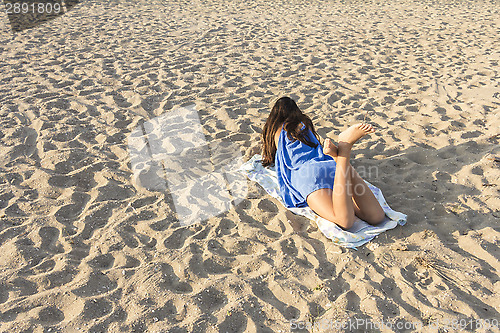 Image of Woman on a sandy beach 