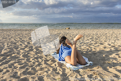 Image of Young Girl on a sandy beach 