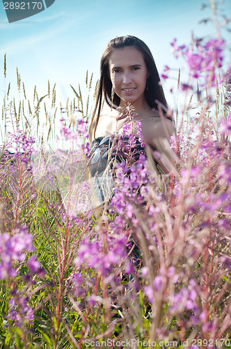 Image of Beautiful female on the flowers field