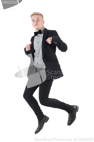 Image of Handsome man in jacket and bow-tie jumping
