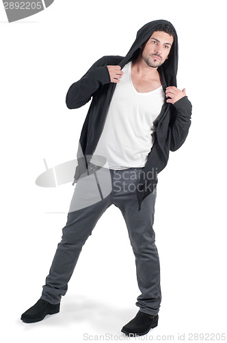 Image of Young cute guy in the whole growth in the hood