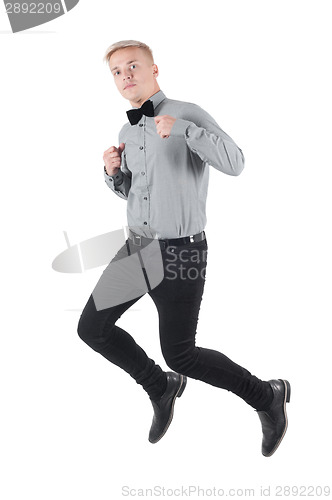 Image of Handsome man in shirt and bow-tie jumping